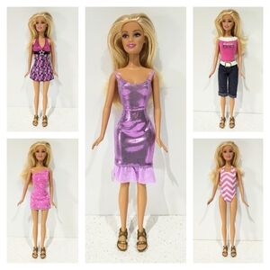 Barbie from 1999 with 5 Looks